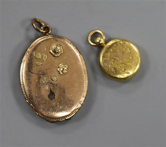 An early 20th century engraved yellow metal pendant and a gold plated oval locket.